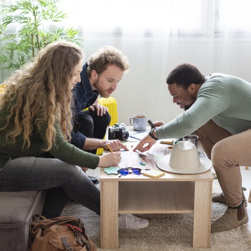 people planning trip with map